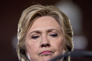 Democratic presidential candidate Hillary Clinton pauses while speaking at a rally 