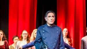 Tony Falla, centre as Javert, and company at the end of the first act in Free Rain's <i>Les Miserables</i>.