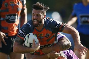 SYDNEY, AUSTRALIA - MARCH 26: James Tedesco of the Tigers is tackled during the round four NRL match between the Wests ...