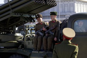 File - A North Korean soldier smiles from the back of an army vehicle at Kumsusan Memorial Palace in Pyongyang, North Korea, before a parade of thousands of soldiers commemorating the 70th birthday of the country's late leader Kim Jong Il on Thursday, Feb. 16, 2012.