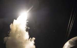 The guided-missile destroyer USS Ross, conducting naval operations in the Mediterranean Sea, fires a Tomahawk land attack missile April 7, 2017.