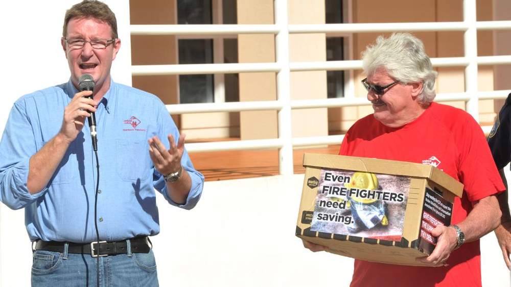 Union warrior: Matthew Gardiner [left] campaigns for firefighters in 2014 as NT Secretary of United Voice.&amp;nbsp;Photo by Justin Sanson, NT News.