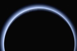 This image made available by NASA in March 2017 shows Pluto illuminated from behind by the sun as the New Horizons ...