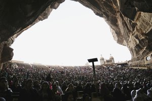 Christians pray during Palm Sunday mass inside the Cave Cathedral or St. Sama'ans Church on the Mokattam hills overlooking Cairo, Egypt, Sunday, April 9, 2017.