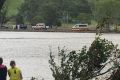 Emergency crews search the Tweed River near Tumbulgum for a missing car.