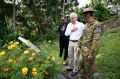 Prime Minister Malcolm Turnbull is given a tour of gravesites by the Governor of Oro Province Gary Juffa (left) and Lt ...