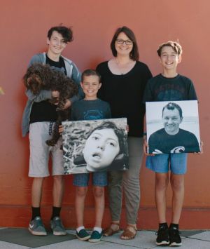 The Kings: Jalen, Milly (the dog), Kobe, Lisa and Harrison with pictures of Noah and Aaron