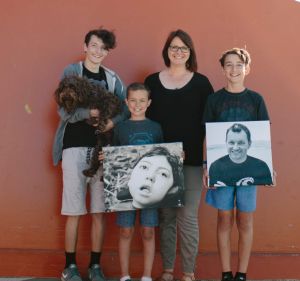 The Kings: Jalen, Milly (the dog), Kobe, Lisa and Harrison with pictures of Noah and Aaron