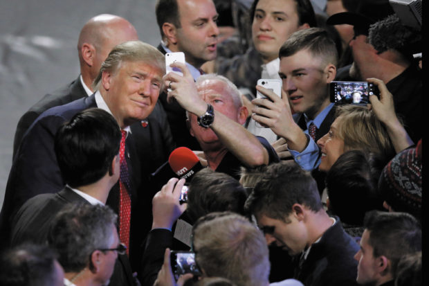 Donald Trump posing for photographs after he delivered the convocation at Liberty University, an evangelical university in Lynchburg, Virginia, January 2016