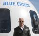 Jeff Bezos, chief executive officer of Amazon.com Inc. and founder of Blue Origin LLC, pauses while speaking at the ...