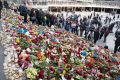 People leave flowers on the steps at Sergels Torg following Friday's attack in central Stockholm, Sweden.