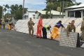 The temporary flood levee in Rockhampton is taken down as the Fitzroy River continues to recede.