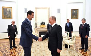 Syrian President Bashar al-Assad greets Russian President Vladimir Putin at the Kremlin, Moscow, Russia, 20 October, 2015.