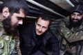 FILE - In this Dec. 31, 2014 file photo, released by the Syrian official news agency SANA, Syrian President Bashar ...