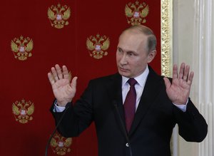 Russian President Vladimir Putin reacts during a joint press conference with Italian counterpart Sergio Mattarella after a meeting in Moscowís Kremlin, Russia, Tuesday, April 11, 2017.