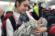 Turkish Airlines cabin crew pose with newborn Kadiju. 