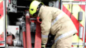 Anonymous firefighter at fire engine fire tender good generic quality image