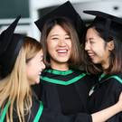 Graduating from Ulster University today with degree in Food Nutritian, Law Yan Ting, Ghan, Chu Yu and Chung, Hiu Shan from Hong Kong. Pic By Paul Moane / Aurora PA