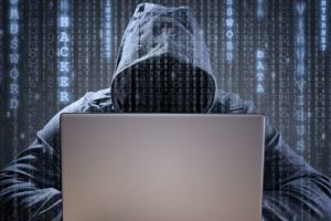 Computer hacker stealing data from a laptop concept for network security, identity theft and computer crime Brazil has ...