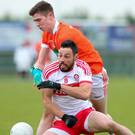 Soaring starlet: Midfield ace Ben Crealey (rear) can bolster Armagh’s hopes of success