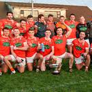 Team effort: Armagh players celebrate with the O’Fiaich Cup after their six-point win over holders Tyrone at Crossmaglen