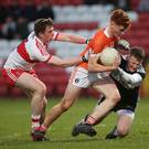 Race on: Armagh’s Jason Duffy with Derry duo Michael McEvoy and Ben McKinless. Photo: Lorcan Doherty/Presseye.com