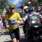 On the run: Chris Froome was forced to sprint for around 200m after his bike was broken following a bizarre crash involving the motorbikes