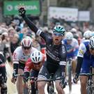 Nice one: Sam Bennett celebrates after winning stage three of Paris-Nice yesterday