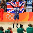 Laura Trott of Great Britain celebrates winning gold in the women's Omnium Points race on Day 11 of the Rio 2016 Olympic Games at the Rio Olympic Velodrome on August 16, 2016 in Rio de Janeiro, Brazil. (Photo by Tom Pennington/Getty Images)