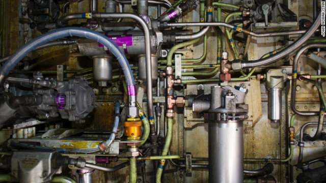 Pipes, cables and pumps line the interior of a wheel well on a Southwest Airlines plane parked at the Atlanta airport.