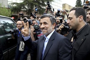 Former Iranian President Mahmoud Ahmadinejad flashes the victory sign as he arrives at the Interior Ministry to register his candidacy for the upcoming presidential elections, in Tehran, Iran, Wednesday, April 12, 2017.