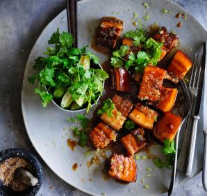 Red braised caramelised pork belly with fresh finger limes.