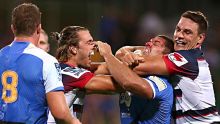 PERTH, AUSTRALIA - FEBRUARY 27:  Ben Meehan and Mitch Inman of the Rebels wrestle with Matt Hodgson of the Force during ...