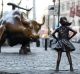 In this March 22, 2017 photo, the Charging Bull and Fearless Girl statues are shown on Lower Broadway in New York.