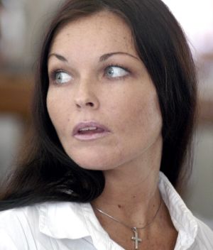 Corby looks to her lawyers during her trial in  July, 2005.
