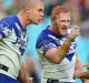 Bulldogs players David Klemmer and James Graham confront referee Gerard Sutton in a memorable Good Friday clash in 2015.