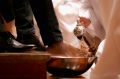  The Reverend Canon Heather Patacca washes feet during the Choral Eucharist on Thursday at St Paul's Cathedral.