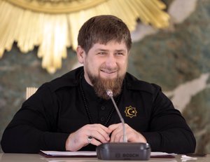 In this file photo taken on Monday, Dec. 28, 2015, Chechen regional leader Ramzan Kadyrov speaks to journalists in Chechnya's provincial capital Grozny, Russia. Intensifying his political attacks on Russia's opposition, the leader of Russia's Chechnya republic posted a video Monday, Feb. 1, 2016, that appears to show Mikhail Kasyanov, a former prime minister who now heads an opposition party, in the crosshairs of a rifle's scope.