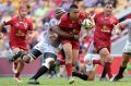 Duncan Paia'aua of the Reds is tackled during Queensland's round eight Super Rugby win over the Kings at Suncorp Stadium.