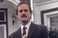 John Cleese as his iconic character Basil Fawlty in Fawlty Towers.