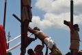 Reuben Enaje re-enacts Christ's crucifixion in Barangay San Pedro Cutud in Pampanga, north of Manila