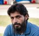 Zeeshan Akbar's friend, housemate and colleague Adnan Amjid, at the scene of the fatal stabbing at the Queanbeyan Caltex ...