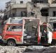 A destroyed ambulance is seen outside the Syrian Civil Defence main centre after airstrikes in eastern Aleppo.