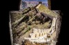 View from a tower on the great wall of China, showing the wall disappearing off into the distance towards the mountain range.