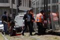 Emergency services at the scene of Friday's stabbing attack in Jerusalem.