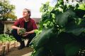 Nursing student Connor Lynch in his vegetable garden at his home in O'Connor, a garden that has helped him eat more ...
