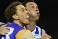 MELBOURNE, AUSTRALIA - AUGUST 06:  Jordan Roughead of the Bulldogs (L) and Todd Goldstein of the Kangaroos compete for ...