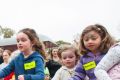 Children and parents frantically start running as the egg hunt begins.