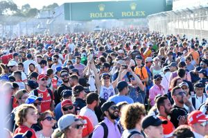 Taking it to the track: Grand Prix fans celebrate after the race at the Albert Park circuit.