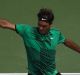 Roger Federer of Switzerland plays a backhand in his match against Rafael Nadal of Spain in the final of the Miami Open.